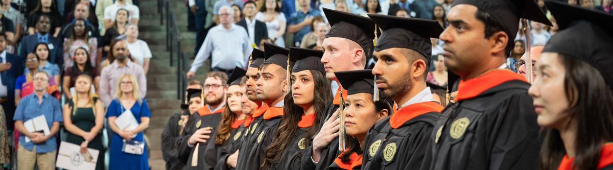 grads and attendees at ceremony