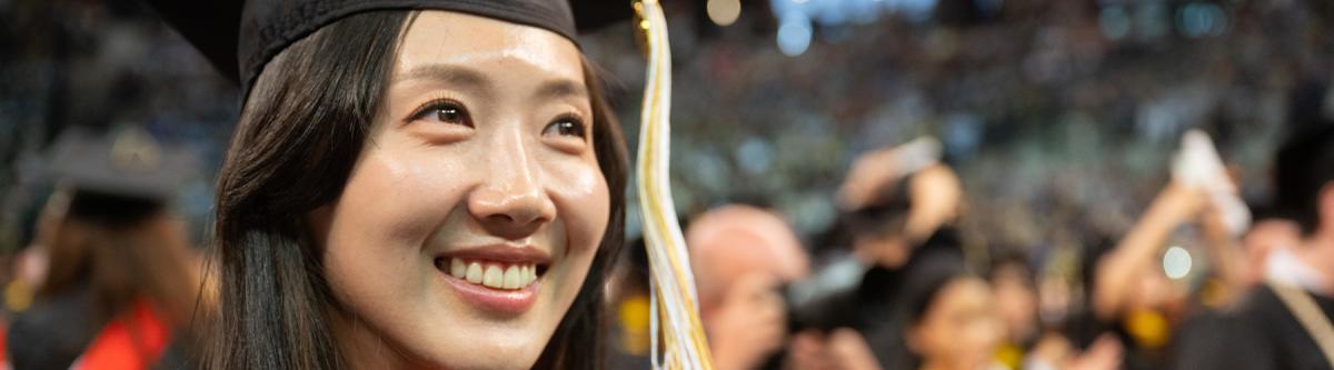 student smiling at ceremony