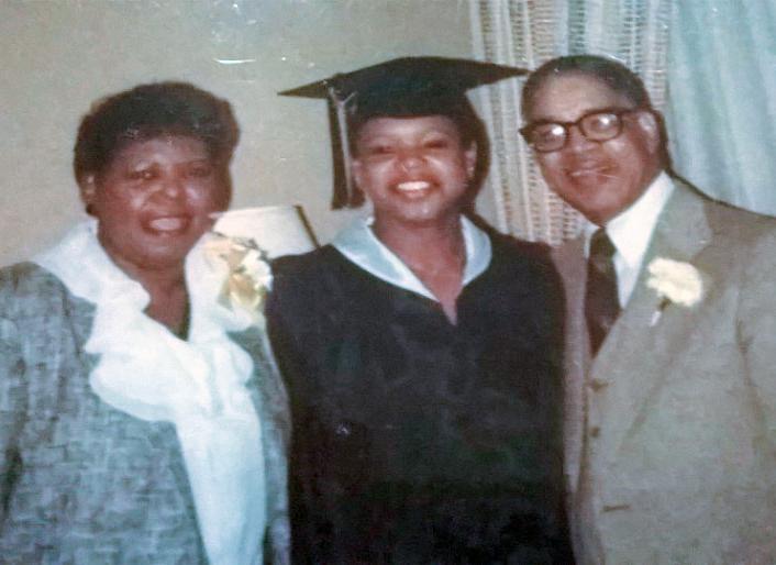 Jacqueline Gilyard Jones with her parents on graduation day