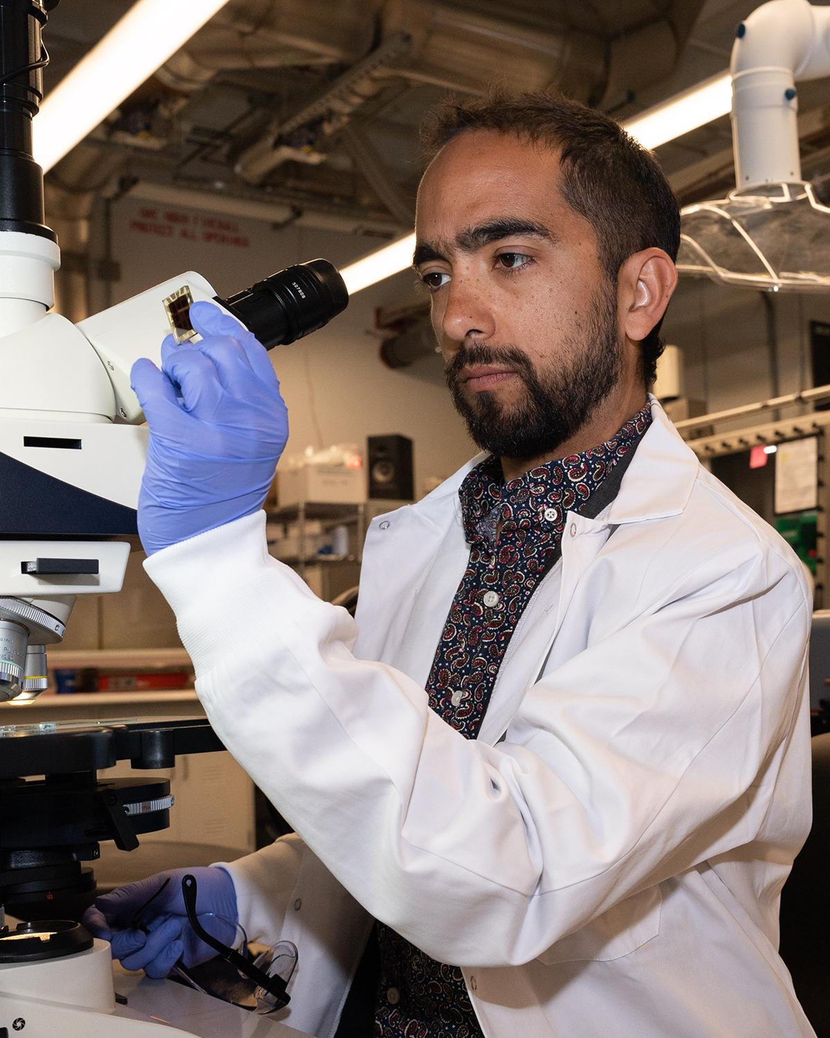 Juan-Pablo Correa-Baena looks at a solar cell in the lab