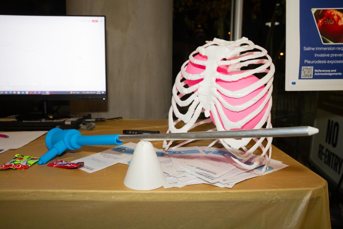 a probe sits on table in front of plastic lungs containing inflated balloons