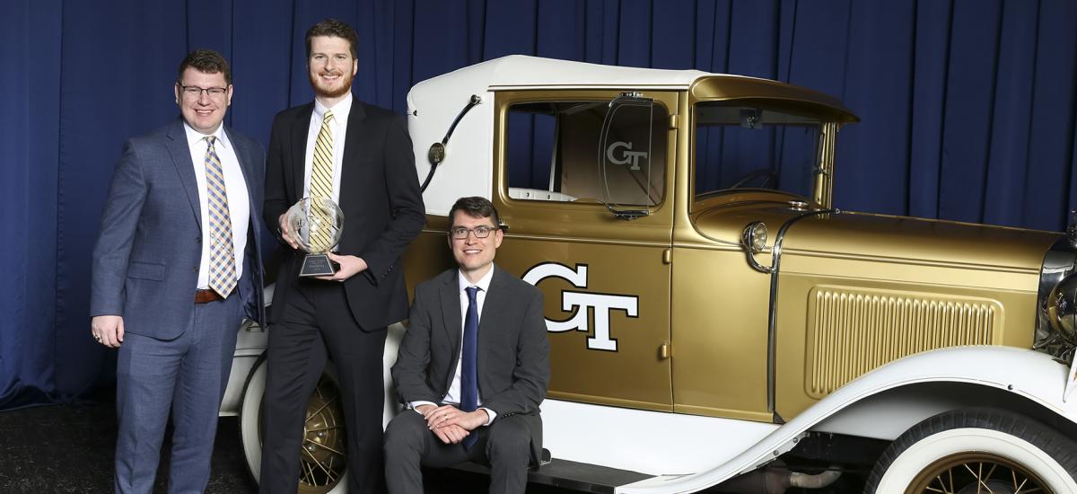 SlateSafety's Zachary Braun, Joseph Boettcher, and Tyler Sisk with the Ramblin' Wreck at the College of Engineering Alumni Awards and Induction Ceremony.