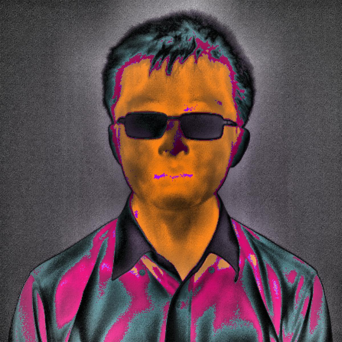 A processed phasor thermographic image of a male subject with contours of color — orange and black on the face with black rectangles where eyeglasses are and pink, gray, and teal colors on the shirt.