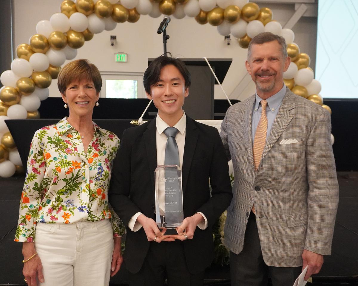 James Shin with the Love Family Foundation Award and two members of the Love Family. (Photo: Emily Creager)