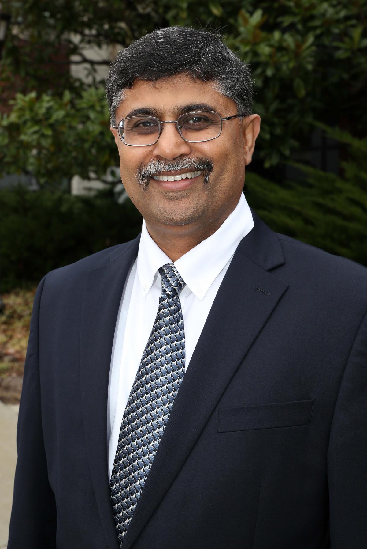 Shreyes Melkote in a suit and tie