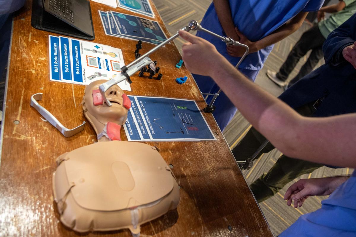 a device sticking in a mannequin's mouth