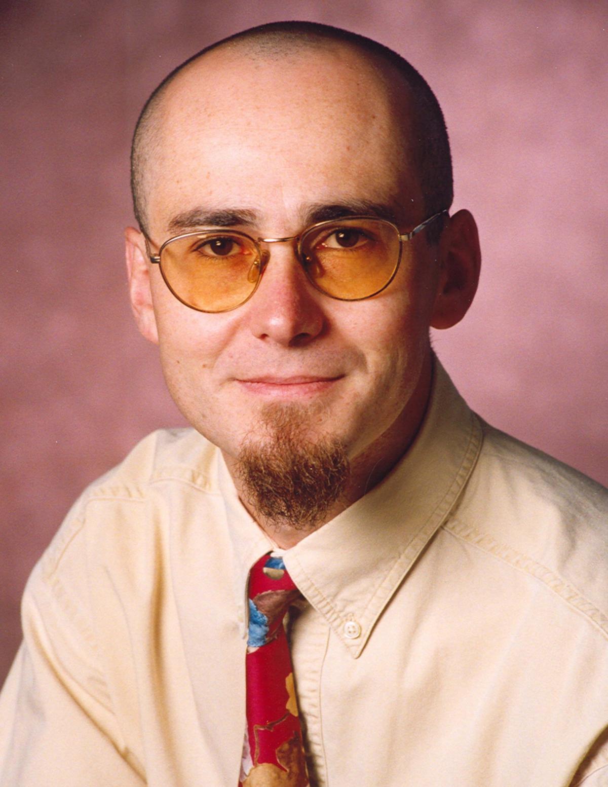 Francois Guillot looking at camera wearing shirt and tie