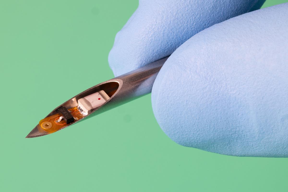 a small implantable device seen in the end of a syringe