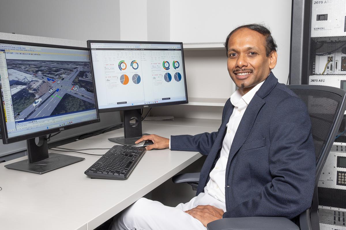 angshuman guin sits at a computer displaying data from a digital replica of North Avenue