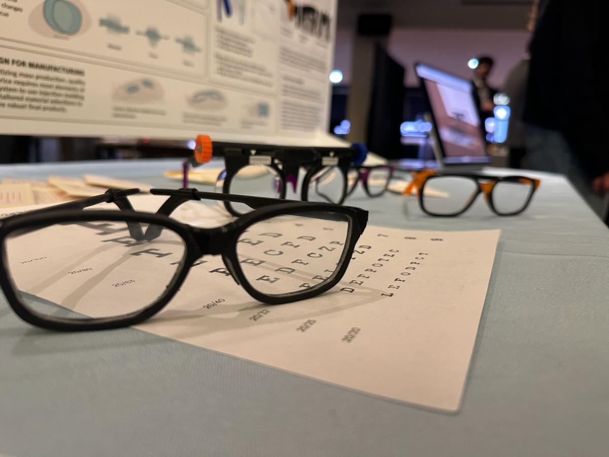 4 sets of glasses on a table and eye chart