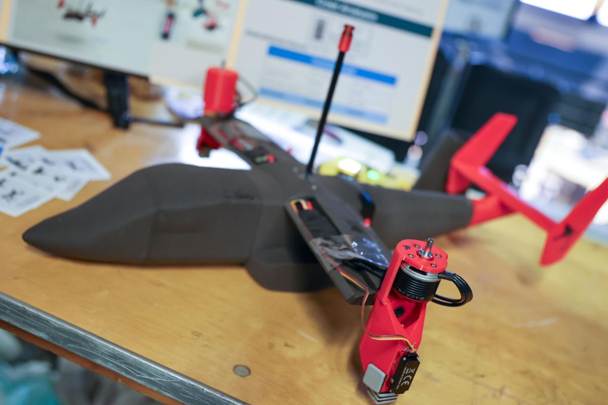 a plane model (black plane with red wing and tail components)