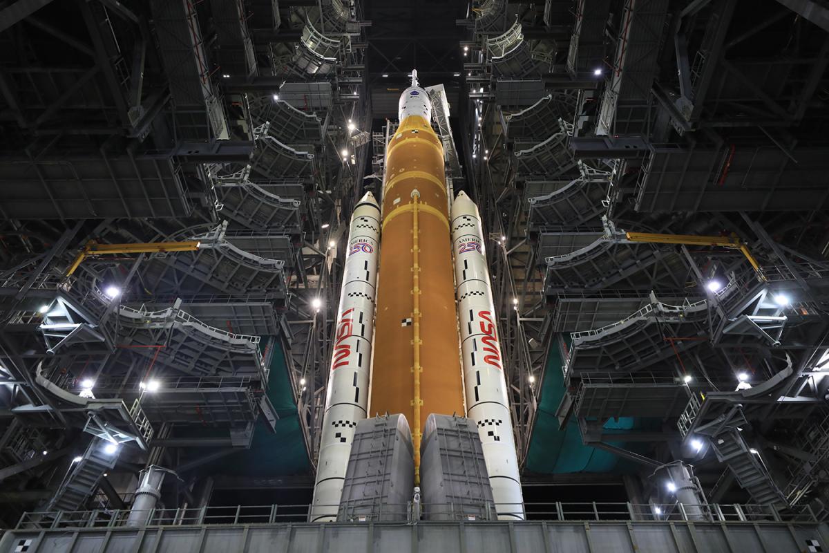 The SLS rocket and Orion spacecraft prepare to leave the Vehicle Assembly Building