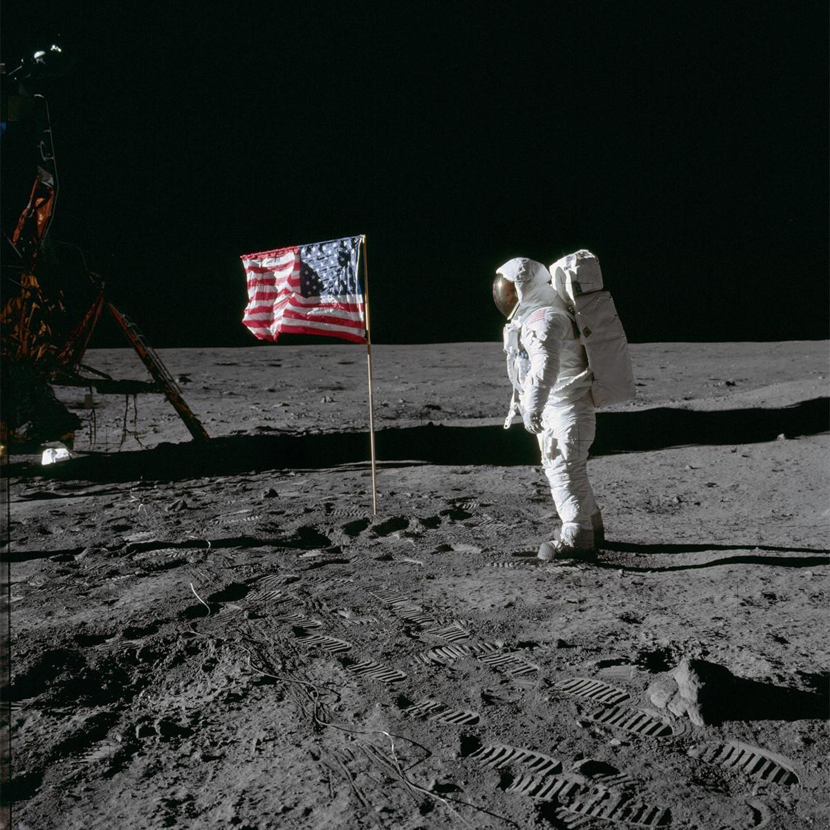 Astronaut Buzz Aldrin on the Moon with the American flag