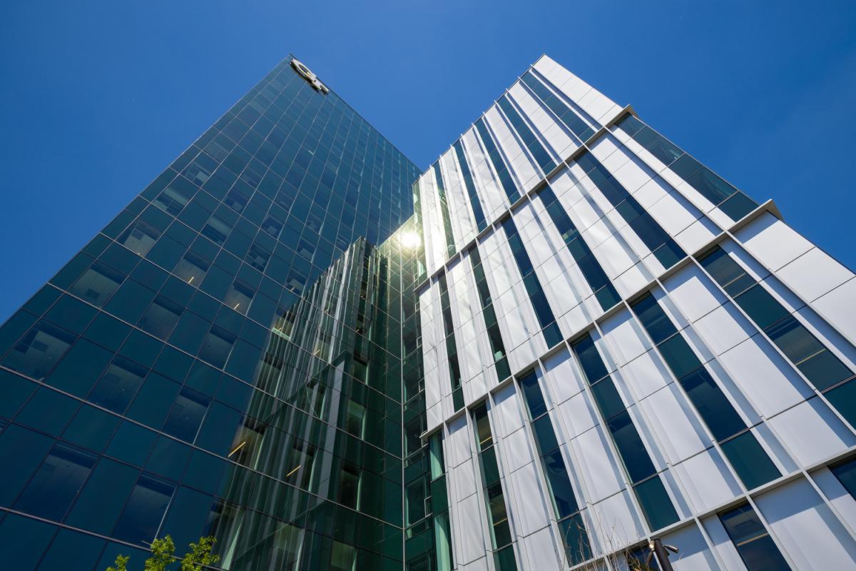Looking up at the George and Scheller Towers against a blue sky
