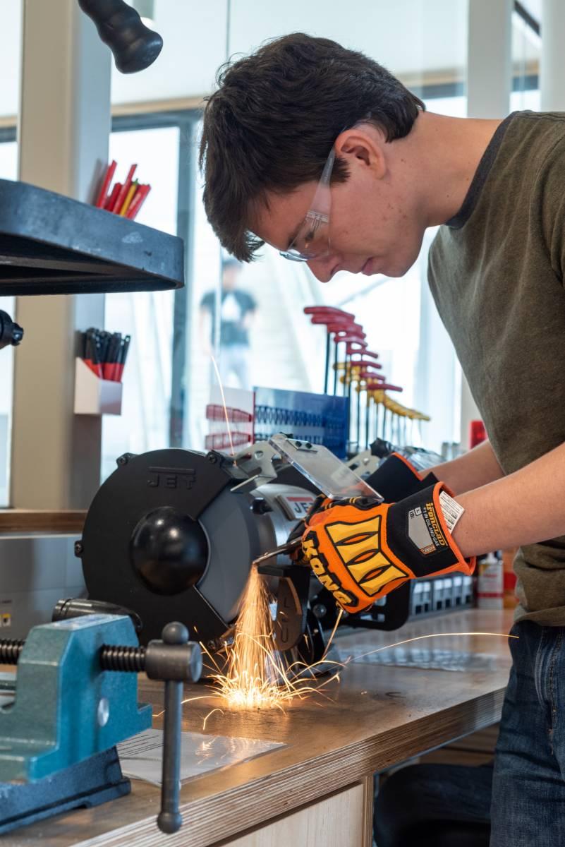 Student works on a piece of machinery