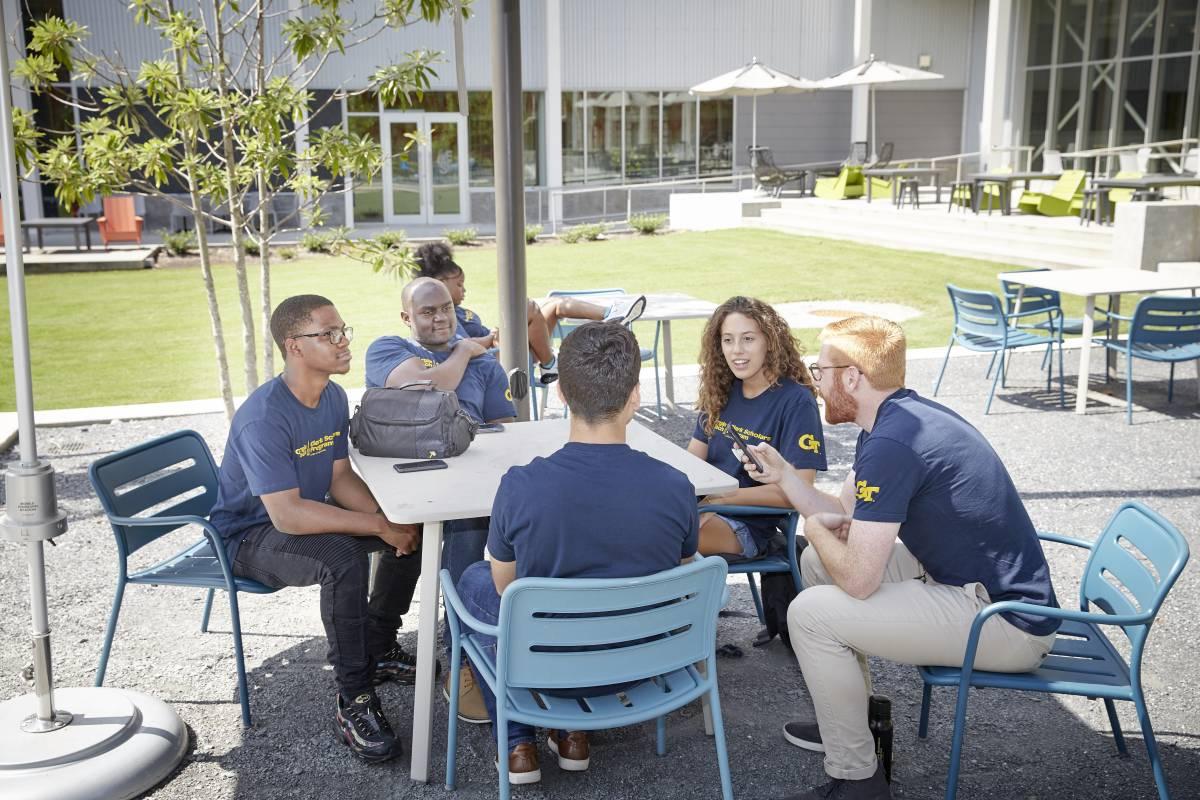 Clark scholars sitting outside