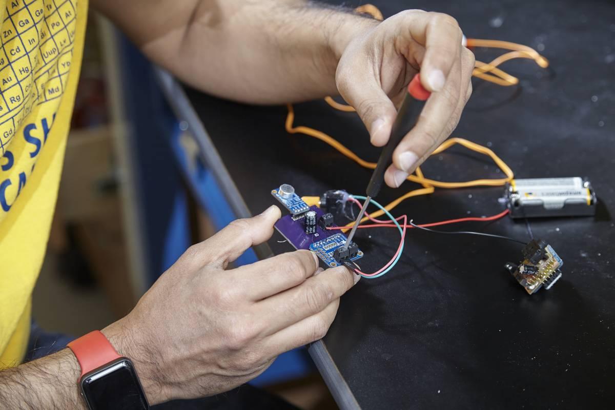 Bhamla working on his hearing aid device