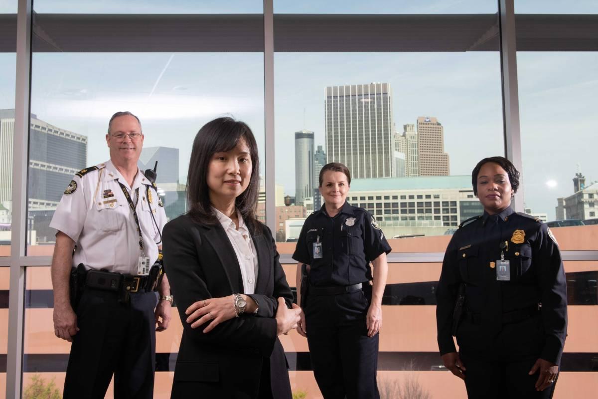 Yao Xie and police officers in office building