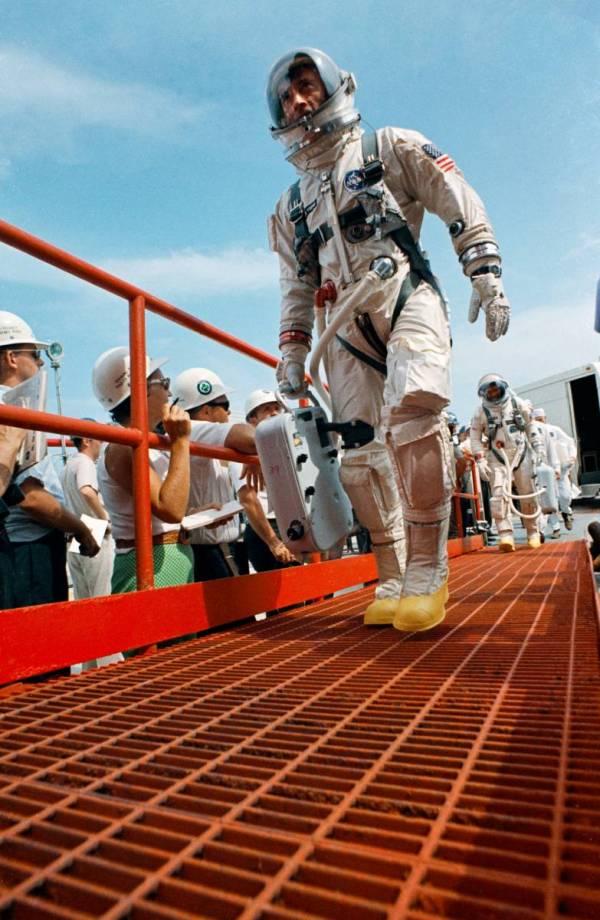 Photo, John Young dressed in spacesuit boarding Gemini 10