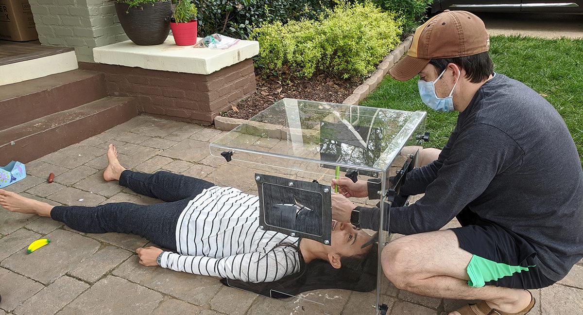 Emory University physician Jay Sanford and his wife Joanne are seen testing the intubation cover that Sanford and Aerospace Engineering doctoral student Lee Whitchter recently refined.