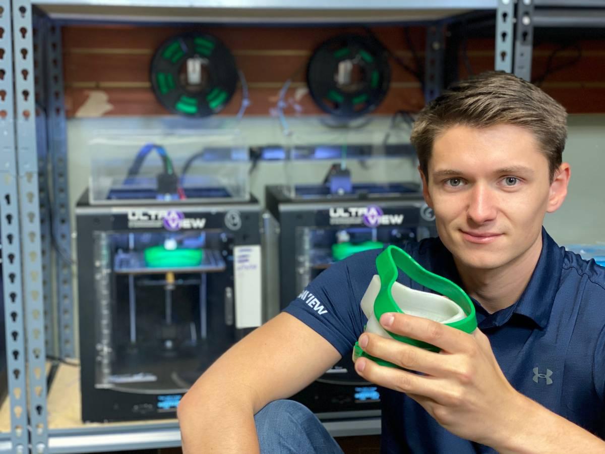 Kolby Hanley at UltraView headquarters with the respirator kits.