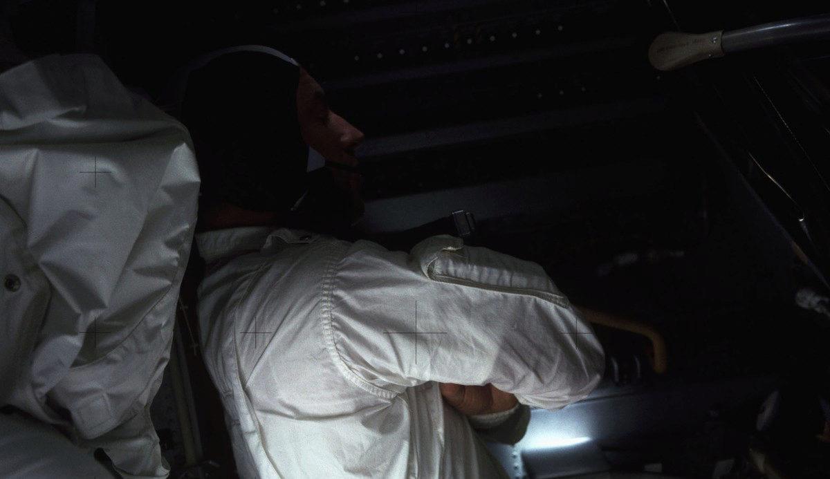 One of the Apollo 13 astronauts trying to sleep in the cold, dark spacecraft after power down. 