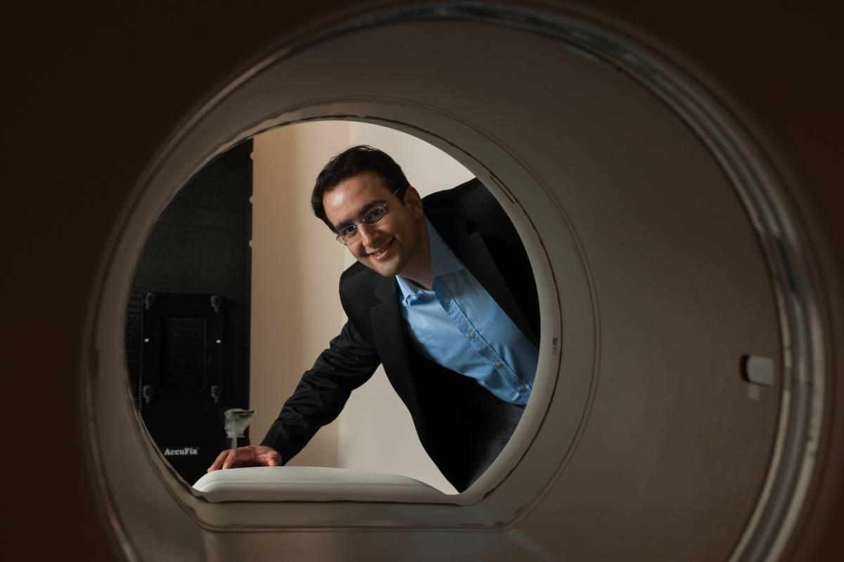 professor looking at equipment