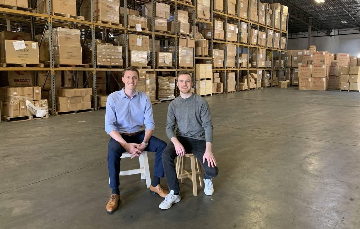 Sean Henry and Jacob Boudreau of Stord in a warehouse