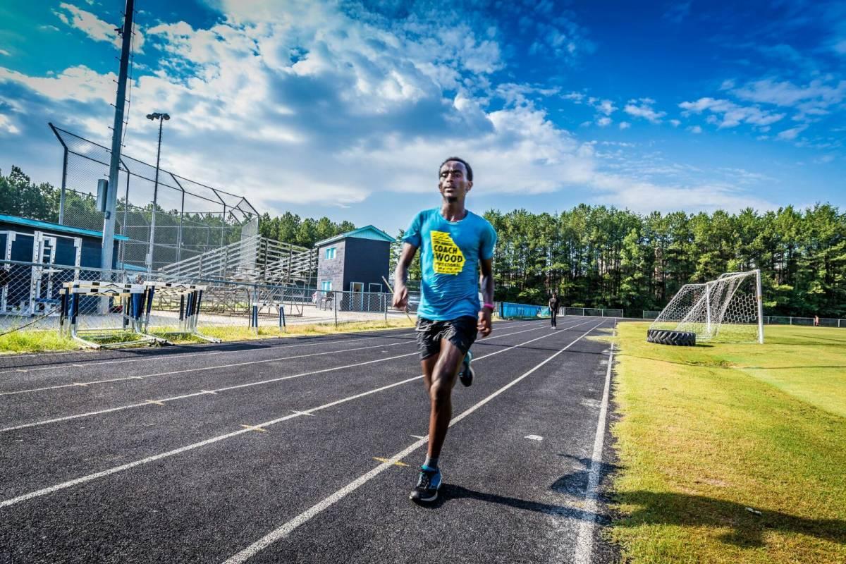 Haile running on a track