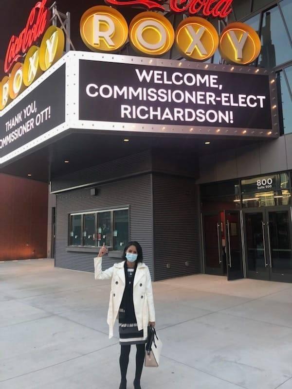 Commissioner Richardson in front of the Coca-Cola Roxy