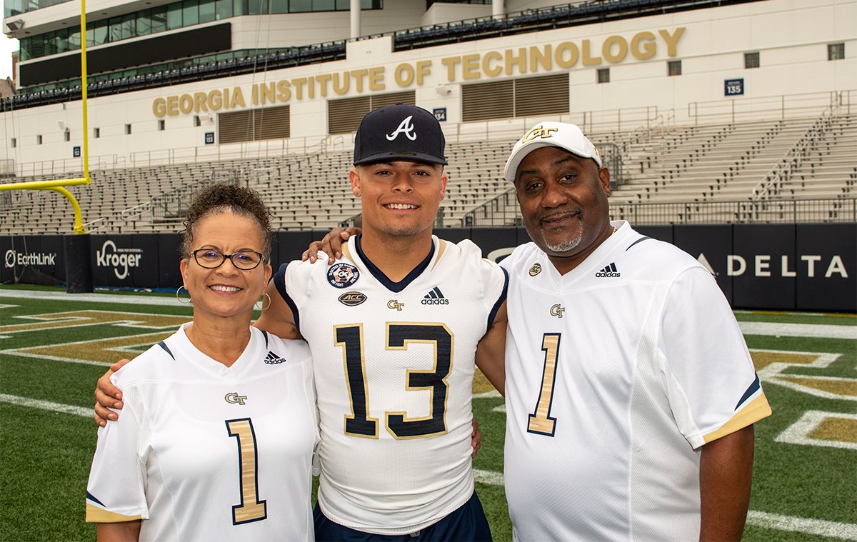 The Ellises standing together in Bobby Dodd Stadium