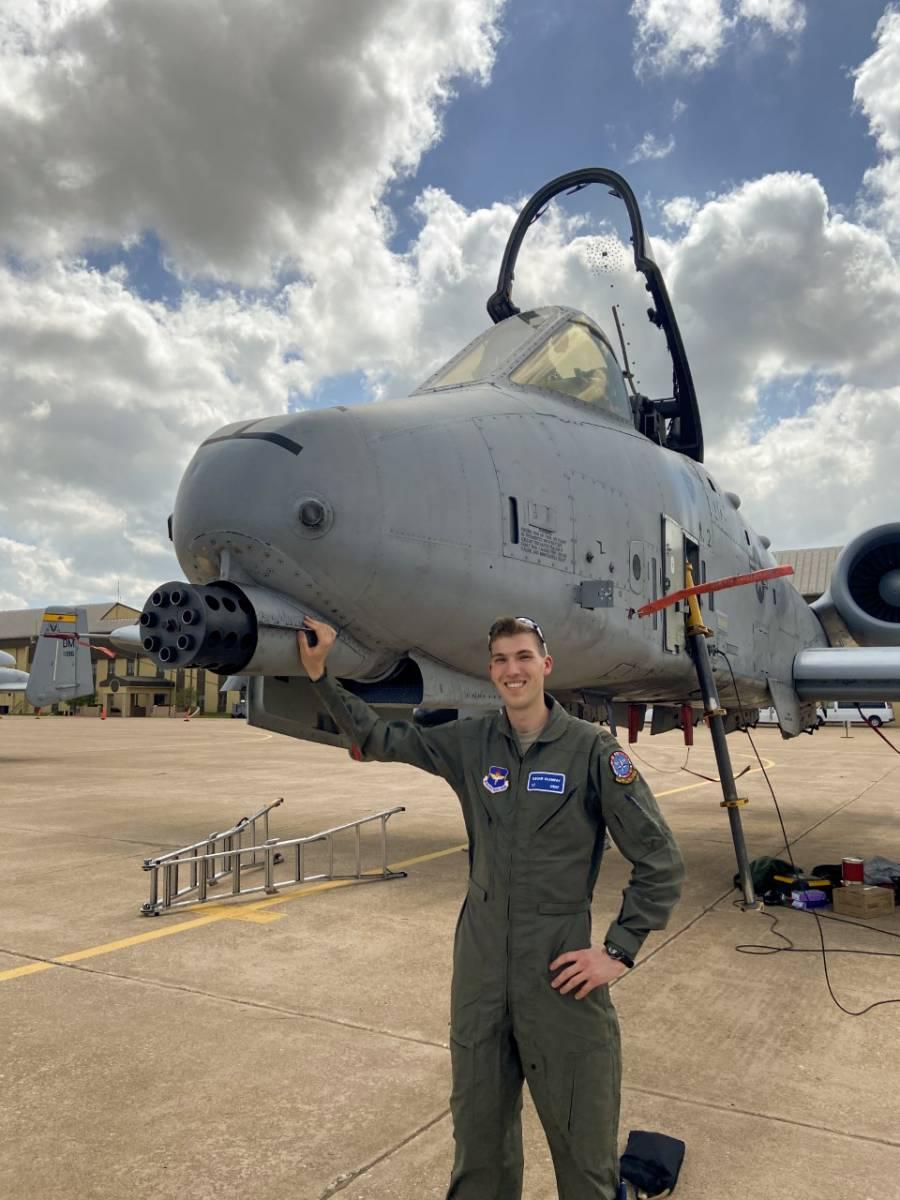 Klempay standing next to an airplane