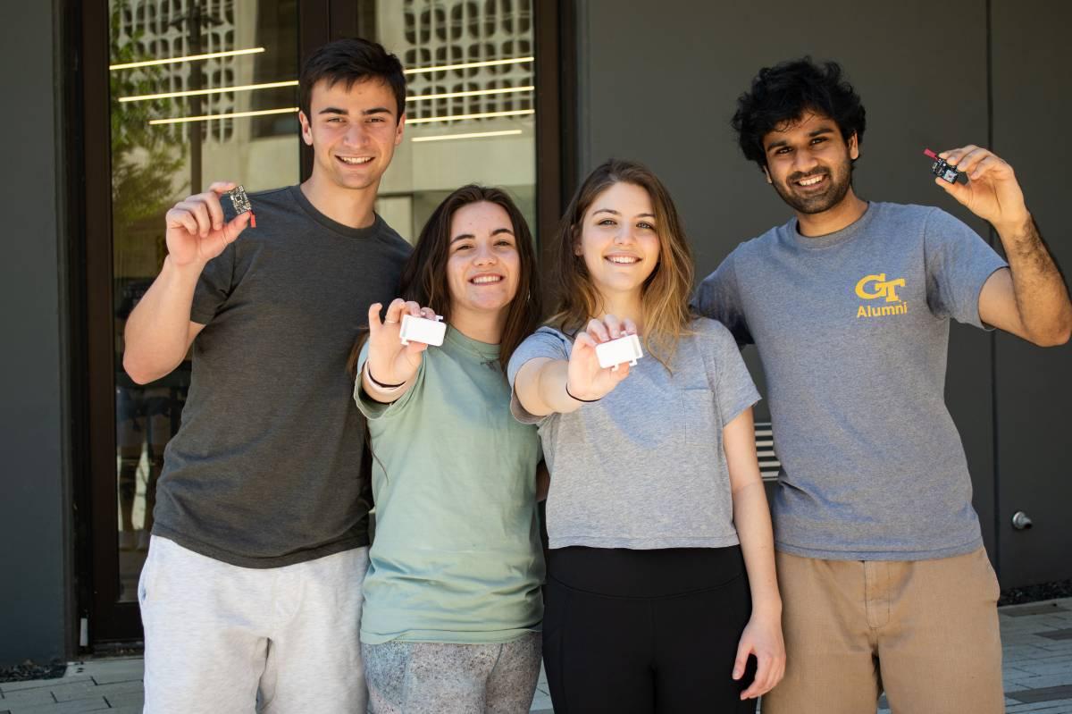 The four founders with the StrideLink device.