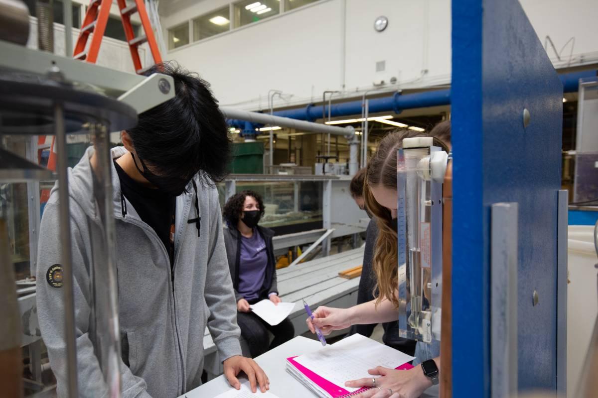 undergraduate students complete worksheets in the lab space