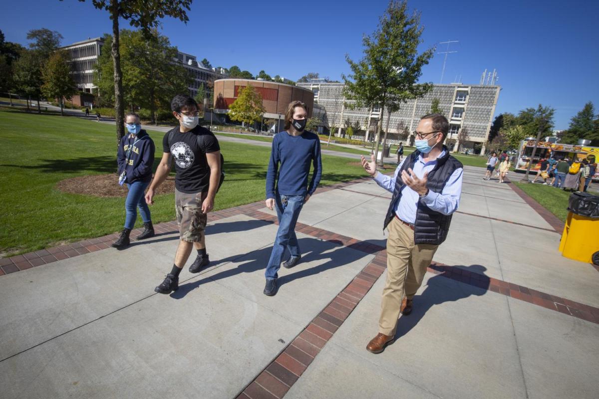 Faculty member with students