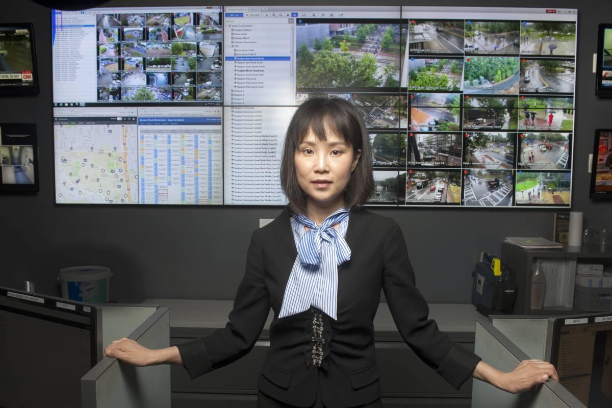 Yao Xie in front of computer screens