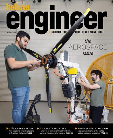 Two people work on a propeller and motor with the magazine nameplate "Helluva Engineer"