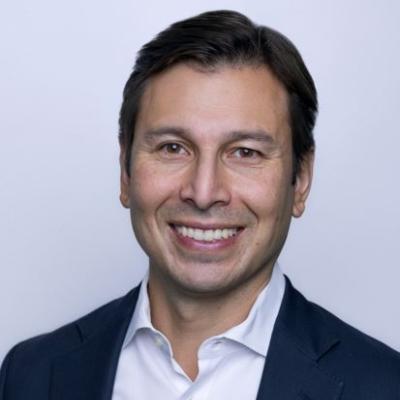 Ragnar-Miguel Myhrer looking at camera in front of grey background